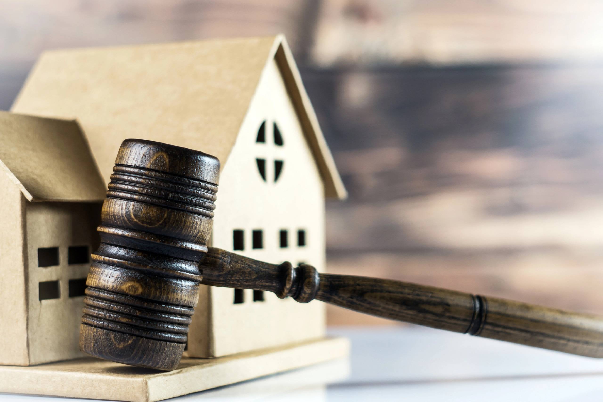 Judge Striking Gavel Between Split House foreclosure