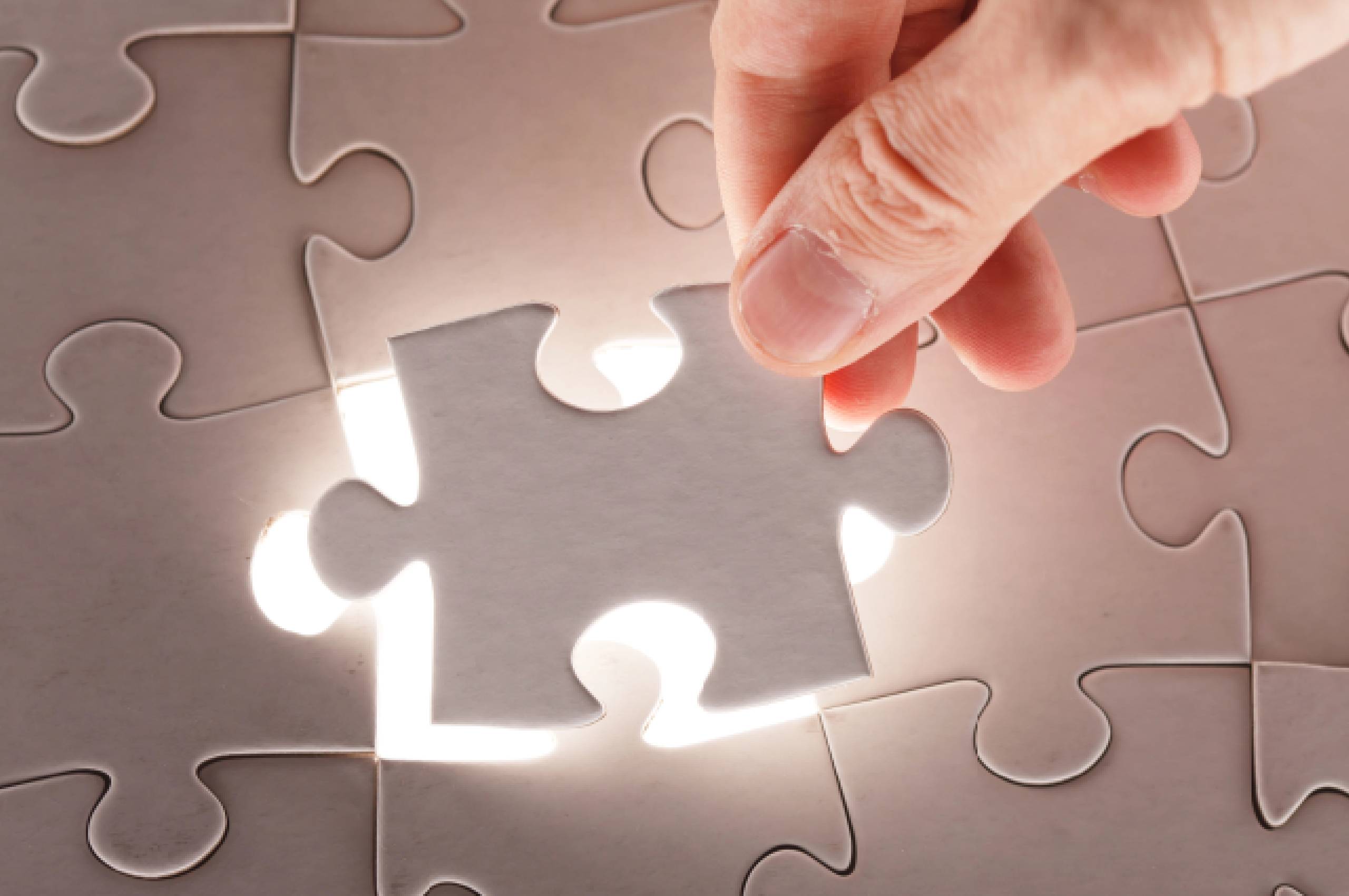 Granting IRS OIC Relief foreclosure attorney Stratford, CT jigsaw puzzle with problem on one and solution on the other